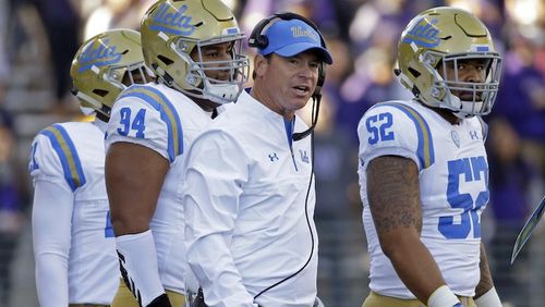 UCLA head coach Jim Mora looks toward the field against Washington in the first half of an NCAA college football game Saturday, Oct. 28, 2017, in Seattle. (AP Photo/Elaine Thompson)