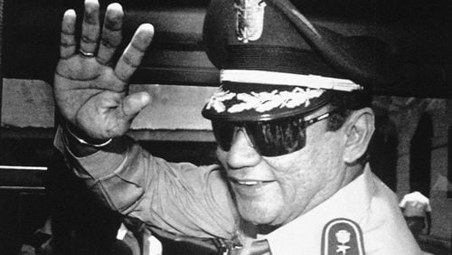FILE - In this Aug. 31, 1989 file photo, Gen. Manuel Antonio Noriega waves to newsmen after a state council meeting, at the presidential palace in Panama City, where they announced the new president of the republic. Panama's ex-dictator Noriega died Monday, May 29, 2017, in a hospital in Panama City. He was 83. (AP Photo/Matias Recart, File)