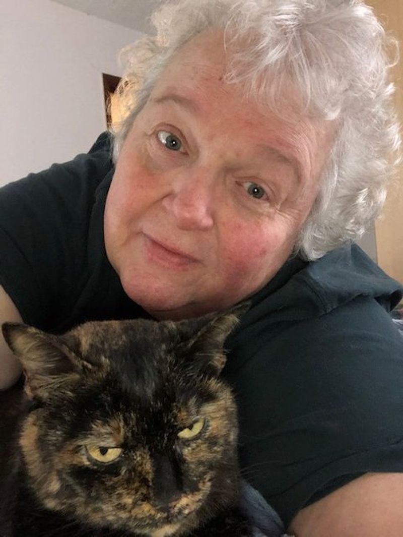 Decatur resident Joan Durdin, a 69-year-old, semi-retired nurse, pictured with her cat, Rose, spent two days in a COVID-19 isolation ward when she started showing symptoms of the virus. She is back home in quarantine awaiting the results of her tests. SPECIAL