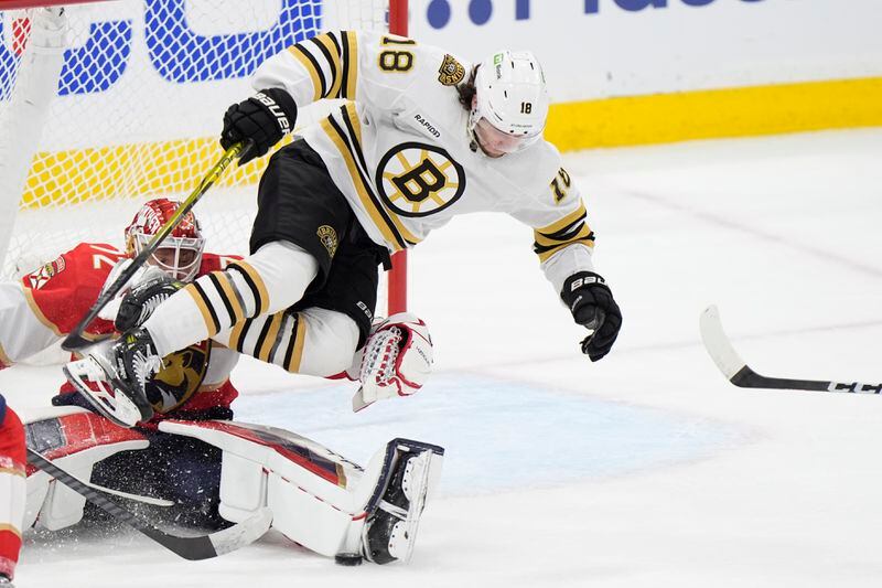 Boston Bruins center Pavel Zacha (18) goes over Florida Panthers goaltender Sergei Bobrovsky (72) during the second period of Game 1 of the second-round series of the Stanley Cup Playoffs, Monday, May 6, 2024, in Sunrise, Fla. (AP Photo/Wilfredo Lee)