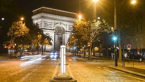 A nocturnal view of the Arc de Triomphe de l’Etoile, one of the most famous monuments in Paris. It stands in the centre of the Place Charles de Gaulle, seen from ‘la plus belle avenue du monde’ Champs Elysees. (Artur Widak/Sipa USA/TNS)