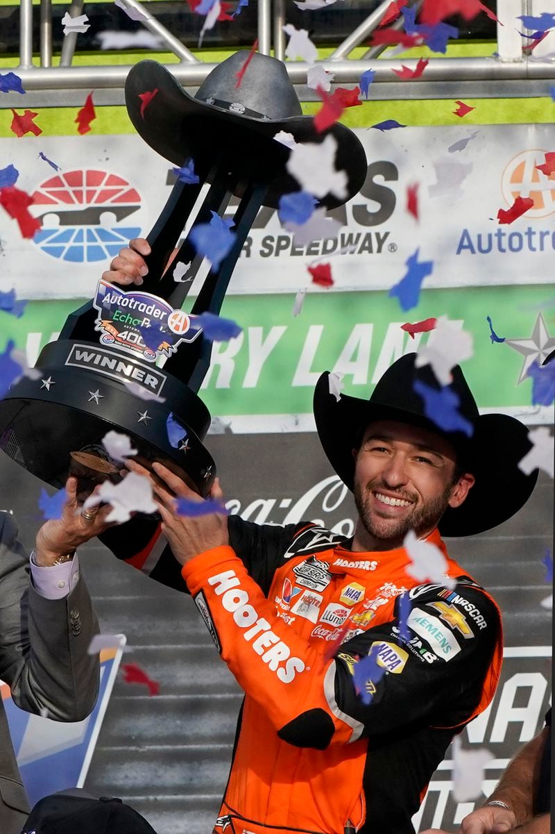 Chase Elliott celebrates with the trophy after winning a NASCAR Cup Series auto race at Texas Motor Speedway in Fort Worth, Texas, Sunday, April 14, 2024. (AP Photo/Larry Papke)