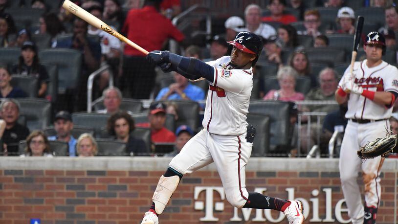 Braves second baseman Ozzie Albies hits a three run home run at Truist Park on Tuesday, June 29, 2021. (Hyosub Shin / Hyosub.Shin@ajc.com)