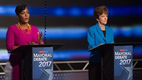 Atlanta mayoral contenders Keisha Lance Bottoms (left) and Mary Norwood speak at the WSB-TV’s live debate Sunday evening, Dec. 3, in Atlanta. The runoff election will be held Tuesday, Dec. 5.