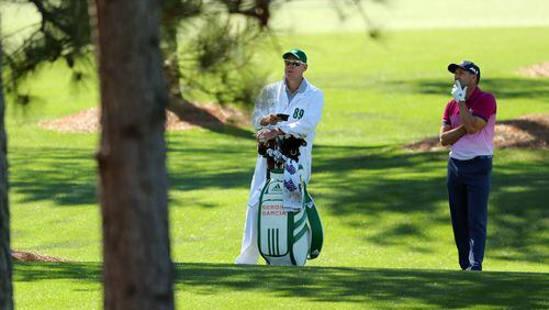 April 8, 2017 AUGUSTA Sergio Garcia and caddie Glenn Murray, check his shot from the woods on the 7th hole. Play begins in the third round of the 81st Masters tournament at the Augusta National Golf Club, Saturday, April 8, 2017. CURTIS COMPTON/ AJC