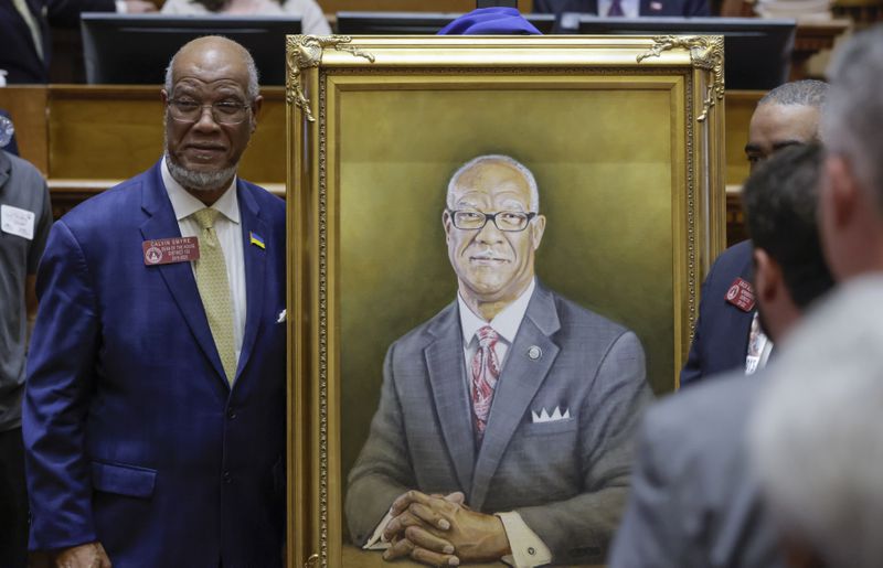 State Rep. Calvin Smyre is greeted by a long line of representatives after his portrait was unveiled on the House floor on April 4, 2022.  Smyre is waiting to be confirmed as U.S. Ambassador to the Bahamas by this Congress. (Bob Andres/AJC)