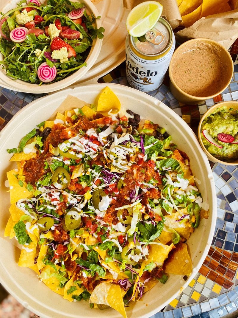 A recent Monday night pop-up saw Happy Seed serving, among other things, a spring salad with strawberries, nachos, guacamole and sikil p’ak, and a toasted pumpkin salsa with Mayan roots. Wendell Brock for The Atlanta Journal-Constitution