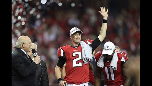 Matt Ryan #2 and Julio Jones #11 of the Atlanta Falcons after defeating the Green Bay Packers in the NFC Championship Game at the Georgia Dome on January 22, 2017 in Atlanta, Georgia. The Falcons defeated the Packers 44-21. (Photo credit: 2017 Getty Images)