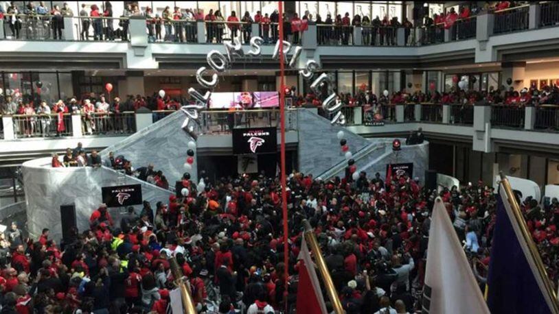 Atlanta Falcons fans fill Atlanta City Hall to capacity on Friday during a pep rally for the Super Bowl-bound team.