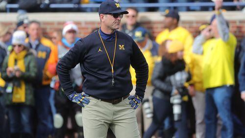 Michigan coach Jim Harbaugh watches his team warm up prior to the game against Penn State on Saturday, Nov. 3, 2018, at Michigan Stadium.