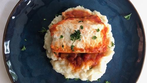 Fish cooks quickly and healthfully in tomato sauce; serve it over cauliflower puree for a delicious low-carb meal.