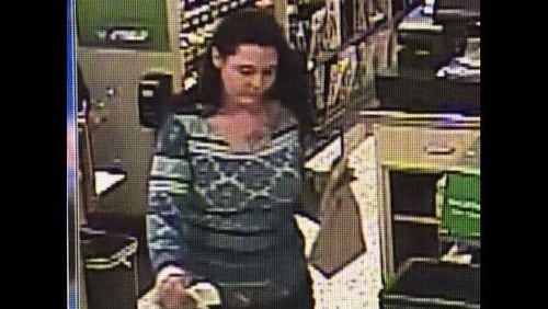 Police in Roswell are looking for this woman who they say stole a wallet and used the credit cards inside to buy gift cards and items at local stores.