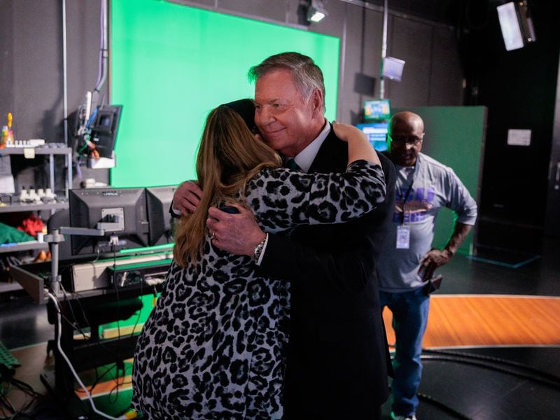 WSB-TV chief meteorologist Glenn Burns, who’s worked at the station for nearly 41 years, hugs news director Suzanne Nadell after announcing his retirement on-air in Atlanta on Thursday, October 27, 2022.   (Arvin Temkar / arvin.temkar@ajc.com)