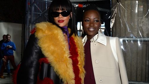 PARIS, FRANCE - MARCH 05:  Singer Rihanna and actress Lupita Nyong'o attend the Miu Miu show as part of the Paris Fashion Week Womenswear Fall/Winter 2014-2015 on March 5, 2014 in Paris, France.  (Photo by Pascal Le Segretain/Getty Images)