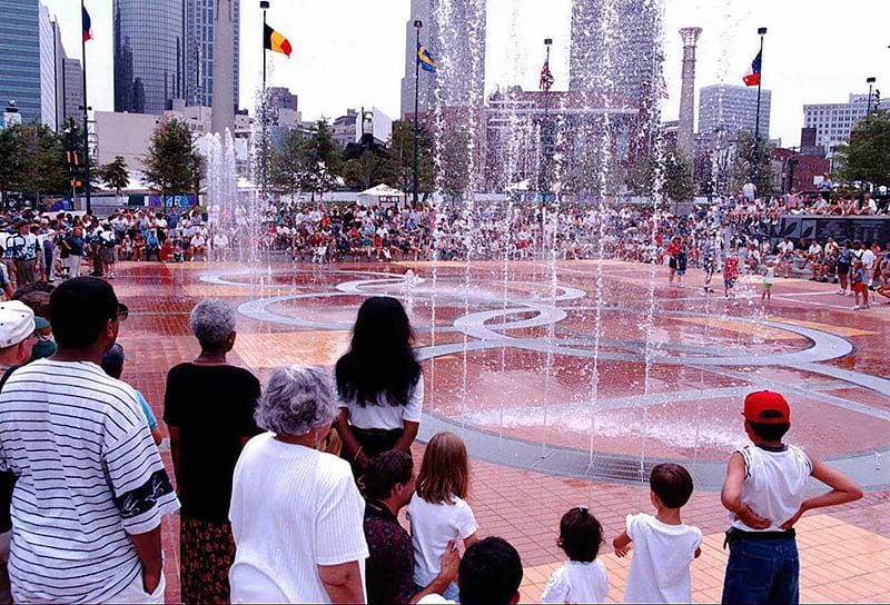Crowds gather to watch the fountains during the official opening ceremony for Centennial Park in Atlanta. (Barton Silverman/New York Times Photo)
