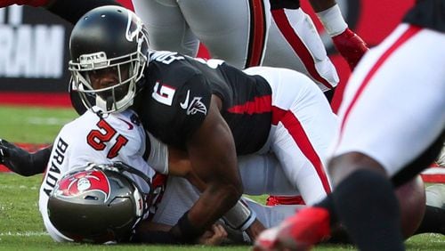 Tampa Bay Buccaneers quarterback Tom Brady (12) is sacked by Falcons defensive end Dante Fowler Jr. (6) as he fumbles the ball during the first half  Sunday, Sept. 19, 2021, at Raymond James Stadium in Tampa. (Dirk Shadd/Tampa Bay Times)