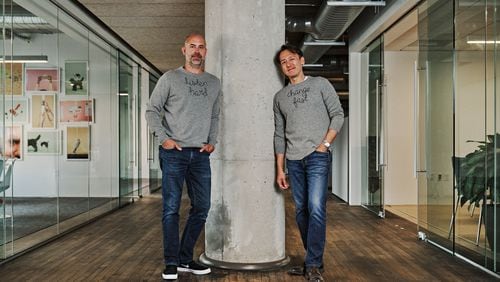 Mailchimp co-founders Dan Kurzius (left) and Ben Chestnut stand at their headquarters in Ponce City Market in 2021.