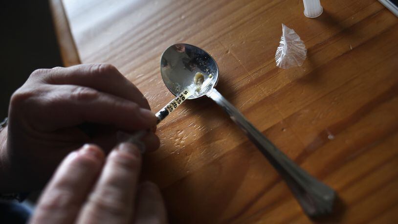 A heroin user prepares to inject himself in New London, CT. Communities nationwide are struggling with the unprecidented heroin and opioid pain pill epidemic.