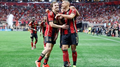 Atlanta United forward Giorgos Giakoumakis (7) celebrates with midfielder Saba Lobzhanidze (9) after scoring the first goal of his team during the first half against the Chicago Fire at Mercedes-Benz Stadium on Sunday, March 31, 2024.
 Miguel Martinez / miguel.martinezjimenez@ajc.com