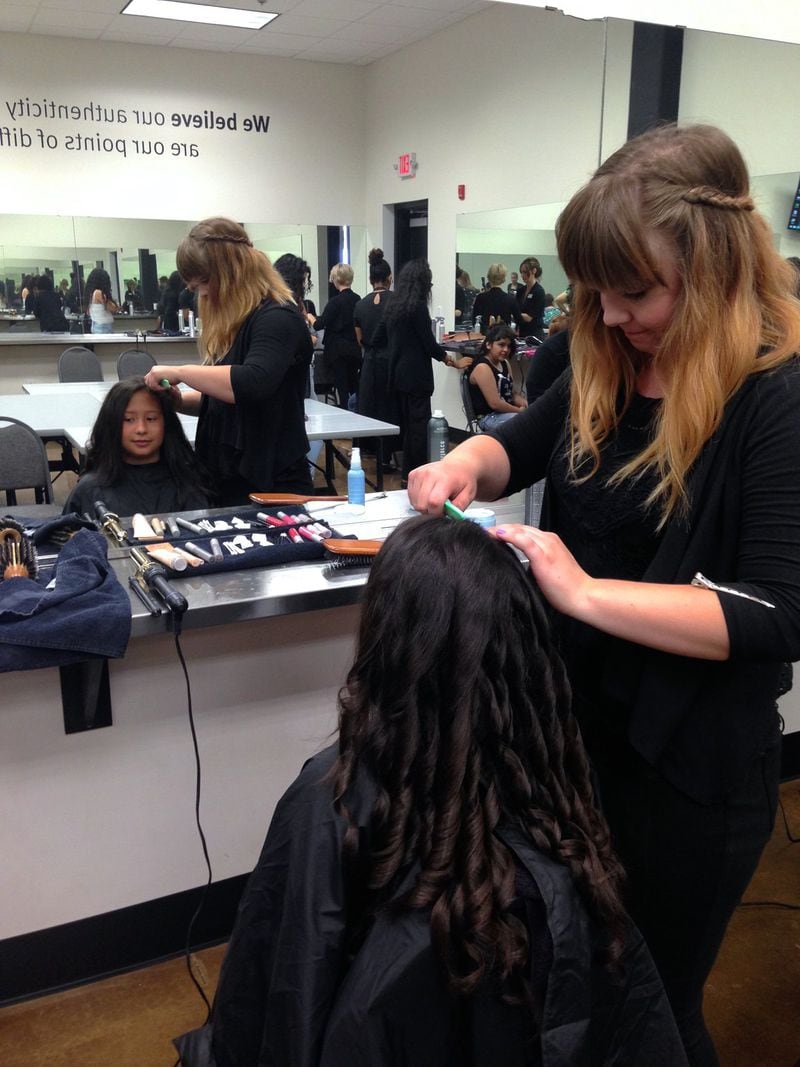 Gabriela Cintron, 14, gets her hair done at the Aveda Institute for her special night at the Hungry Bunch Prom.