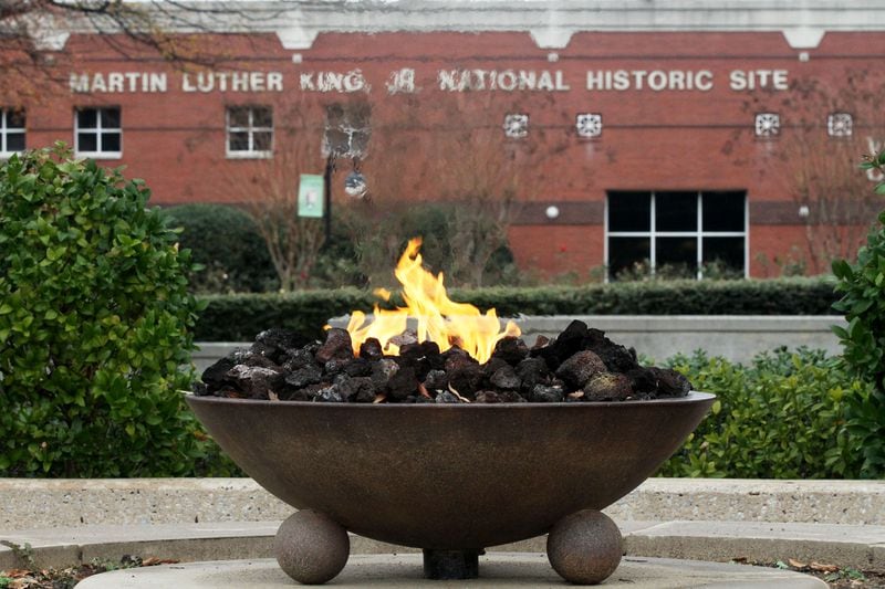 The Eternal Flame burns near the King tomb at the Martin Luther King Jr. National Historic Site on Thursday Jan. 10th, 2013. Story will guide visitors to what to see at the park service's Visitor Center, the King Center, the original Ebenezer Baptist Church and the MLK Birth Home.