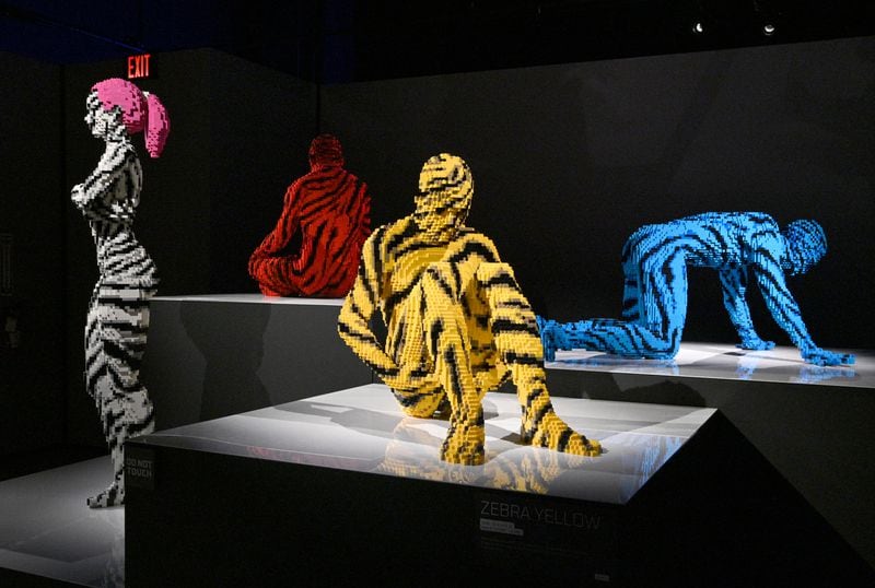 Lego sculptures in “Humanity” room at "Art of the Brick Immersive Experience" exhibition at Exhibition Hub Atlanta Art Centre, Wednesday, April 19, 2023, in Doraville. The exhibition will feature many pieces and themes, including a room with oversized sculptures (25-foot long), over 70 works of art crafted from more than 1 million LEGO bricks, galleries celebrating human-kind and nature, and a short documentary about how Nathan creates his works. (Hyosub Shin / Hyosub.Shin@ajc.com)