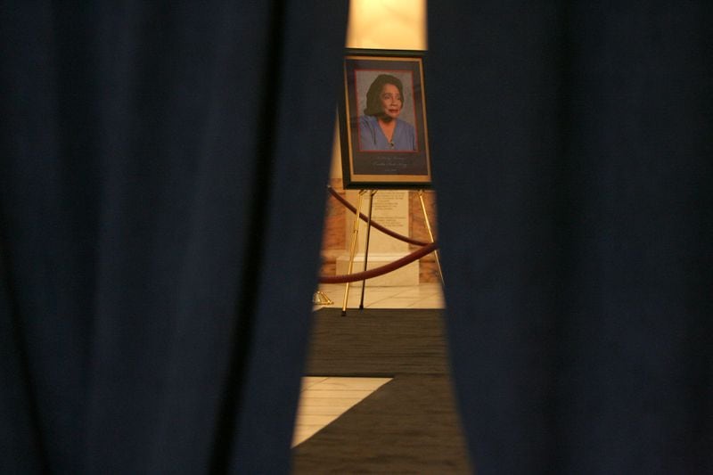 A portrait of Coretta Scott King sits in the Capitol rotunda behind black curtains on Feb. 3, 2006 in preparations for her body to lie in state Saturday. (BEN GRAY/AJC staff)