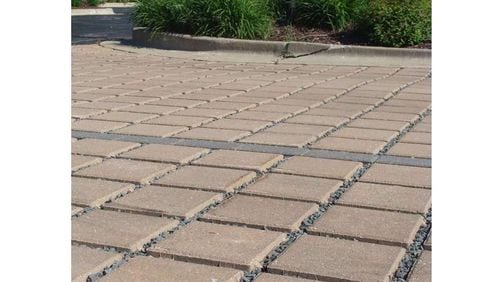 Permeable pavers like these could improve the quality of stormwater discharging from Roswell City Hall to a tributary of Hog Waller Creek. The city is seeking a $150,000 grant to fund the project. AJC FILE