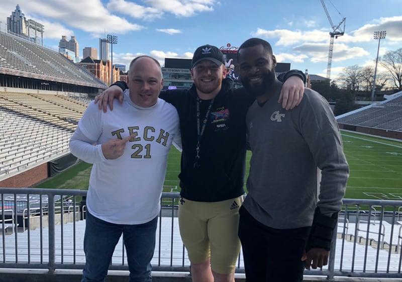 Georgia Tech recruit Grey Carroll poses in Bobby Dodd Stadium with coach Geoff Collins (left) and defensive line coach Larry Knight (right) on a visit to Tech's campus. (Photo courtesy Grey Carroll)