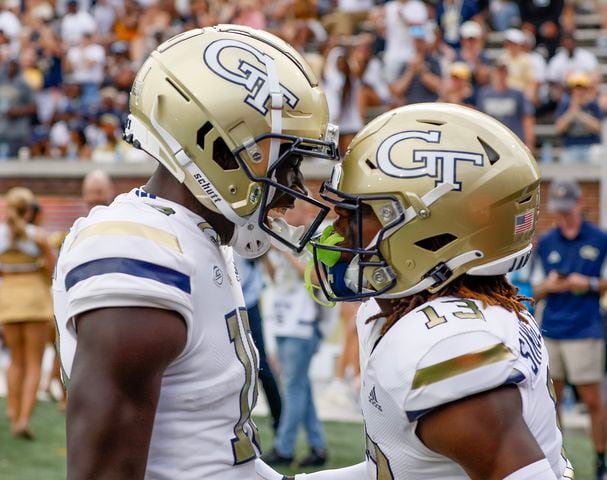 Georgia Tech Yellow Jackets wide receiver Abdul Janneh (18) (left) celebrates with Georgia Tech Yellow Jackets wide receiver Eric Singleton Jr. (13) after Singleton's first half touchdown during  a football game against South Carolina State at Bobby Dodd Stadium in Atlanta on Saturday, September 9, 2023.   (Bob Andres for the Atlanta Journal Constitution)
