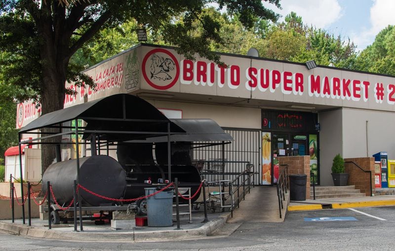 The two large grills outside Brito Supermarket are constantly in use on the weekends. CONTRIBUTED BY HENRI HOLLIS