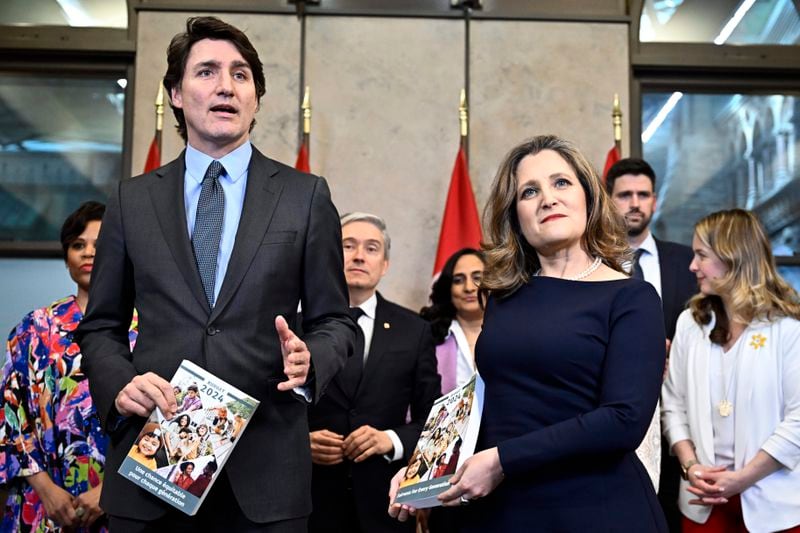 Canada's Prime Minister Justin Trudeau, Deputy Prime Minister, Minister of Finance Chrystia Freeland and cabinet ministers pose for a photo before the tabling of the federal budget on Parliament Hill in Ottawa, Ontario, on Tuesday, April 16, 2024. (Justin Tang/The Canadian Press via AP)