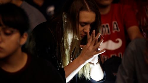 Students from University of Nevada Las Vegas hold a vigil Monday, Oct. 2, 2017, in Las Vegas. A gunman on the 32nd floor of the Mandalay Bay casino hotel rained automatic weapons fire down on the crowd of over 22,000 at an outdoor country music festival Sunday. (AP Photo/Gregory Bull)