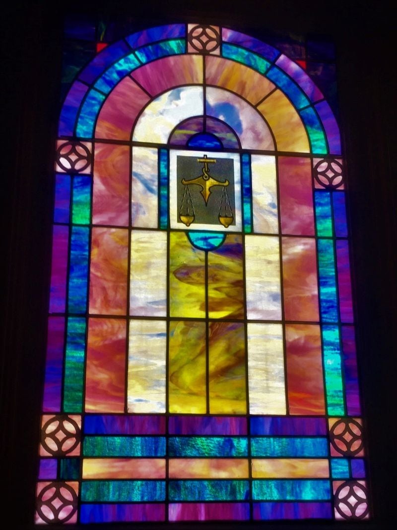 This stained glass window was in Antioch East Baptist Church's Hardee Street sanctuary for decades. When Antioch moved to Ellenwood in 2019 and their sanctuary was demolished, this window, and three others, were preserved and installed in the First Existentialist Congregation's stone church in Candler Park. That same stone structure was once the home of Antioch, from 1922 until 1951. Photo: Edith Kelman
