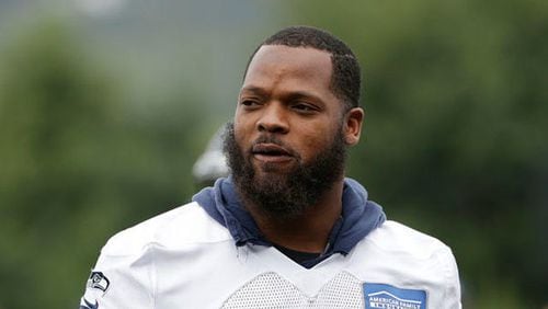 Seattle Seahawks' Michael Bennett walks on the field during the team's NFL football training camp in Renton.