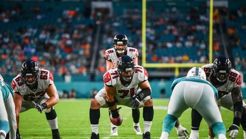 Wes Schweitzer #71 of the Atlanta Falcons snaps the ball in the first quarter during a preseason game against the Miami Dolphins at Hard Rock Stadium on August 8, 2019 in Miami, Florida. (Photo by Mark Brown/Getty Images)