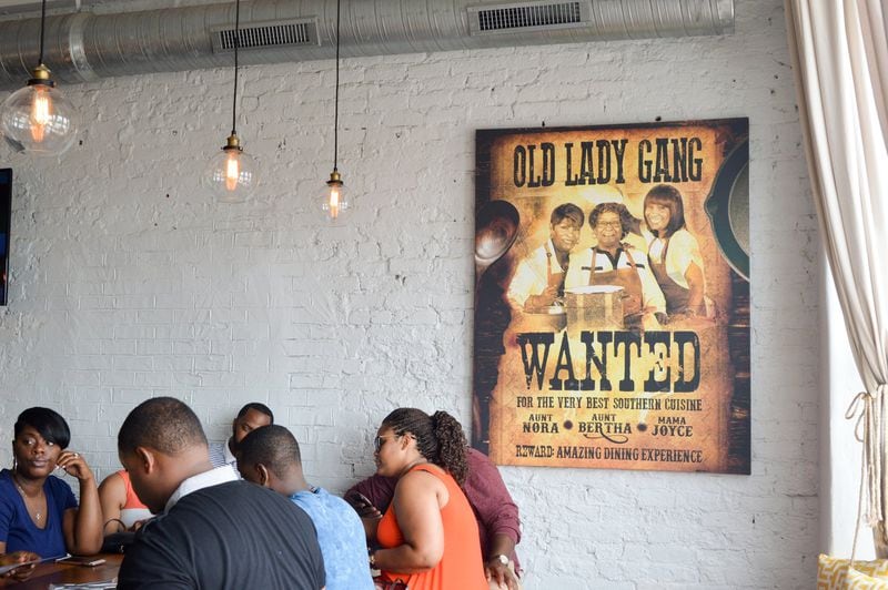 Photos of the members of the self-described Old Lady Gang are never far from view, and they are the mother and the aunts of “Real Housewives of Atlanta” star Kandi Burruss, who launched the restaurant with her husband. CONTRIBUTED BY HENRI HOLLIS
