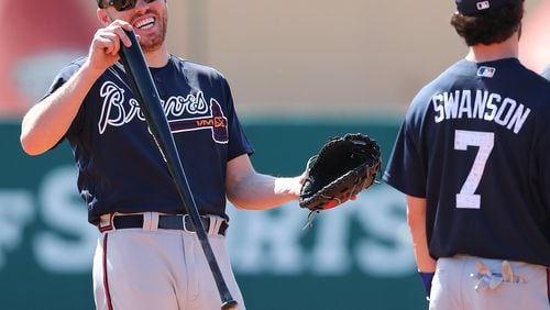 Freddie Freeman shares a laugh with Dansby Swanson during a Feb. 20 workout. Freeman returned to the lineup Wednesday after missing 1 1/2 weeks while at the World Baseball Classic. Swanson has been out since March 4 with back tightness. (Curtis Compton/ccompton@ajc.com)