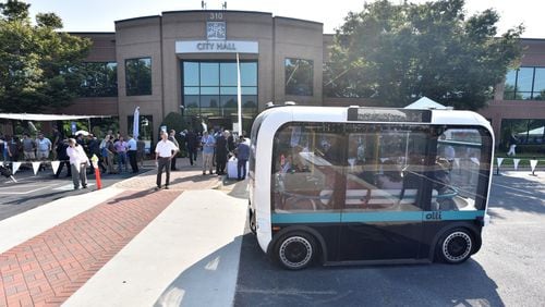 September 11, 2019 Peachtree Corners - Guests ride on Olli, self-driving electric shuttle, during the grand opening of Curiosity Lab at Peachtree Corners on Wednesday, September 11, 2019. Curiosity Lab is a publicly funded, real-world living laboratory and test bed featuring a one and a half mile autonomous vehicle test track within a 500 acre commercial office park. The Lab offers companies the opportunity to transition unique, innovative technologies from controlled environments into an active community. (Hyosub Shin / Hyosub.Shin@ajc.com)