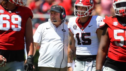 041324 Athens: Head coach Kirby Smart confers with Carson Beck between plays during the G-Day game on Saturday, April 13, 2024.  Curtis Compton for the Atlanta Journal Constitution