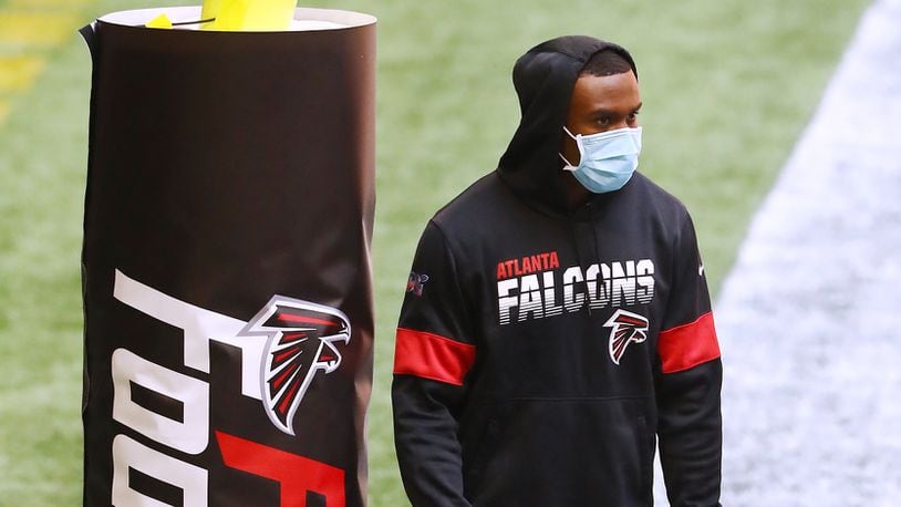 Atlanta Falcons wide receiver Julio Jones, who is not playing in the game, watches from the end zone as his teammates prepare to play the Chicago Bears Sunday, Sept. 27, 2020, at Mercedes-Benz Stadium in Atlanta. (Curtis Compton / Curtis.Compton@ajc.com)