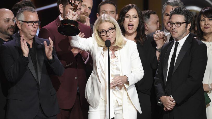 Mary Connelly, center, accepts the award for outstanding entertainment talk show for “The Ellen DeGeneres Show” at the 44th annual Daytime Emmy Awards Sunday. Contributed by Chris Pizzello/Invision/AP