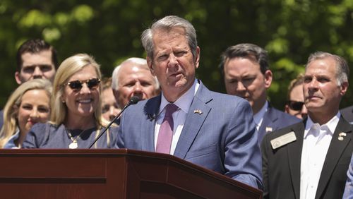 Georgia Gov. Brian Kemp makes remarks before signing Senate Bill 233 known as the Georgia Promise Scholarship Act at Liberty Plaza on Tuesday, April 23, 2024. (Natrice Miller/Atlanta Journal-Constitution via AP)