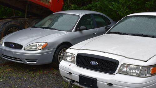 Ford Taurus and Crown Victoria automobiles will be among the items declared surplus by Cherokee County to be auctioned Saturday in Canton. JEFF DOBSON & ASSOCIATES