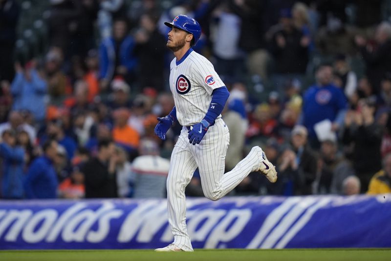 Chicago Cubs' Cody Bellinger runs the bases after hitting a home run during the first inning of a baseball game against the Houston Astros, Tuesday, April 23, 2024, in Chicago. (AP Photo/Erin Hooley)