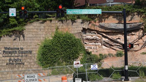 The collapsed wall at the intersection of McGinnis Ferry Road and Windward Parkway is on the way to be reconstructed and shoppers will no longer inconvenienced by the closure of a main access to a popular South Forsyth commercial area. Marty Farrell for the AJC