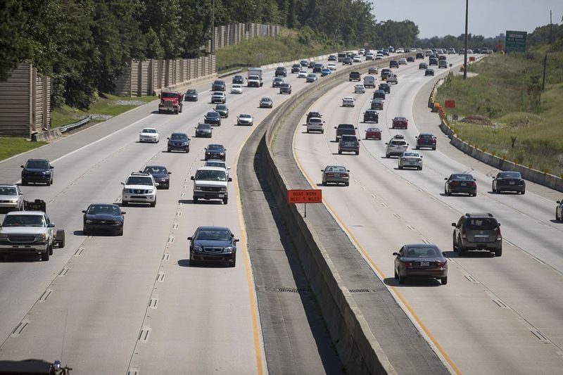 Automobiles travel along Georgia 400, Wednesday, July 24, 2019. Cities along Ga. 400 are talking about petitioning the Georgia Department of Transporation to have a say in how the new highway is being designed as part of the ongoing widening project. (Alyssa Pointer/alyssa.pointer@ajc.com)