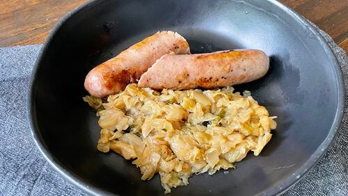 Classic City bratwurst from Pine Street Market is infused with Creature Comforts' Classic City lager. Angela Hansberger for The Atlanta Journal-Constitution