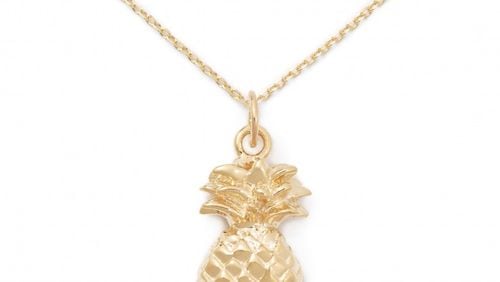 The 14K solid gold pineapple pendant costs $250 from Delicacies Jewelry.