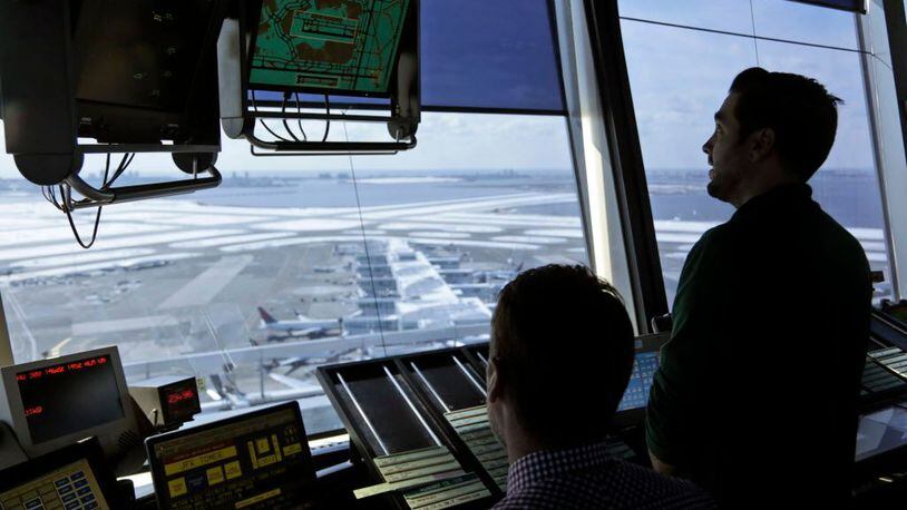 Air traffic controllers work March 16, 2017, in the tower at John F. Kennedy International Airport in New York.